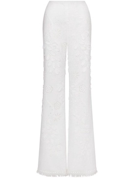 Embroidered and cut-out design trousers in cotton