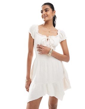 Bershka shirred milkmaid mini dress in pale pink