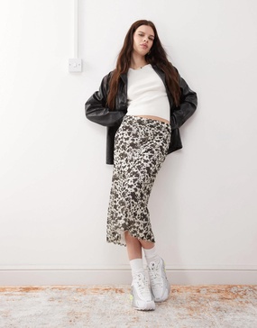 Reclaimed Vintage slinky midi skirt in mini cow print