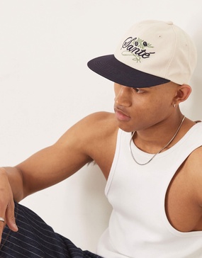 ASOS DESIGN cap with embroidery detail and contrast peak in ecru and navy
