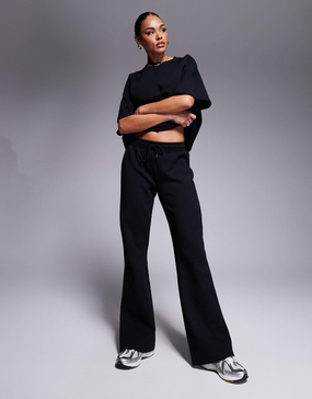 ASOS DESIGN interlock flared sweatpants in black - part of a set