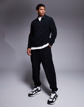 ASOS DESIGN tapered fleece sweatpants in black