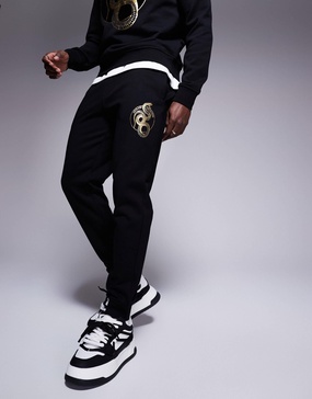 Armani Exchange lunar capsule snake sweatpants in black