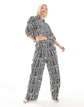 ASOS DESIGN straight leg pull on pants in black and white print - part of a set