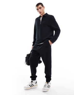ASOS DESIGN tapered rib sweatpants in black