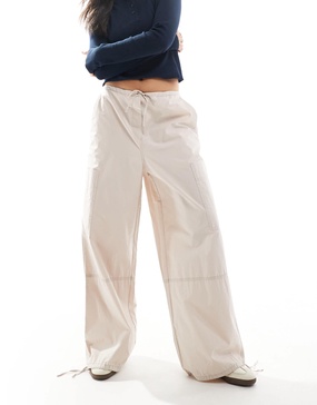 ASOS DESIGN pants with tie hems and clean utility pockets in stone