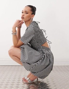 Amy Lynn shirred peplum mini dress with tie back in mono gingham
