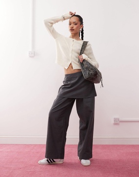 Reclaimed Vintage mini skirt over pants in gray