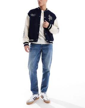 ASOS DESIGN tapered jeans in tinted dark wash blue