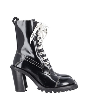 laced-up combat boots in black patent leather