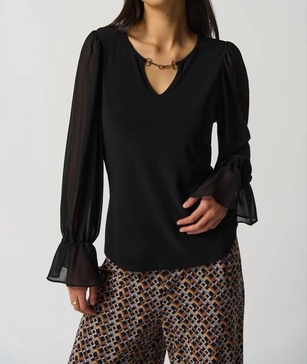 ruffle sleeve top in black