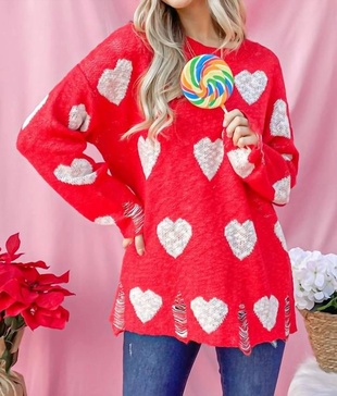 distressed sweater with hearts in red