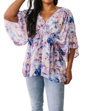 fabled in floral draped peplum top in blue