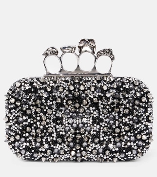 Knuckle embellished leather clutch