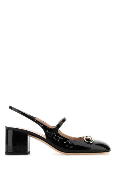 Black leather pumps
