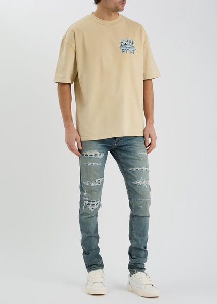 Quad Repaired distressed skinny jeans 