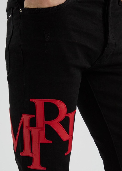 Staggered logo skinny jeans 