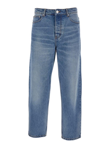 Blue Jeans With Tapered Leg And Logo Patch On The Rear In Denim Man