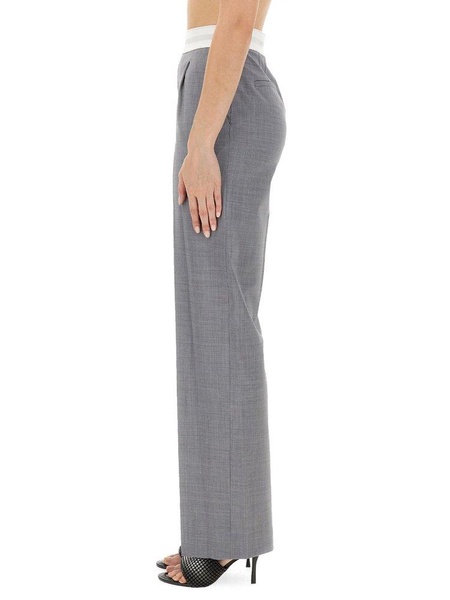 HIGH WAIST STRETCH PANTS WITH PLEATS AND LOGO