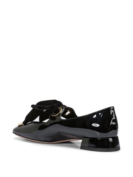 Black ballet flats with a heart-shaped neckline