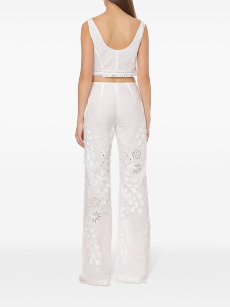 Embroidered and cut-out design trousers in cotton