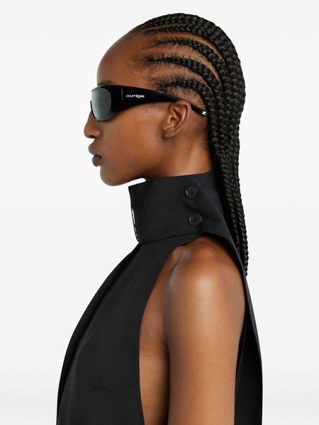Black sleeveless turtleneck blouse by Courrèges