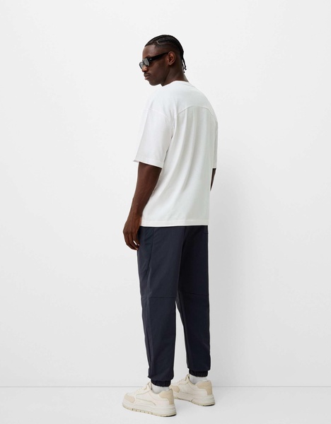 Bershka nylon pants in navy