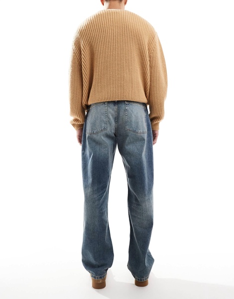 ASOS DESIGN baggy jeans in mid wash with abrasions