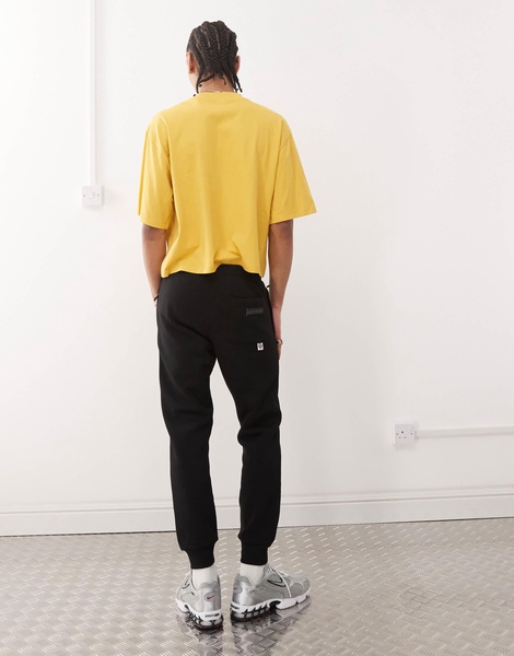 Aape By A Bathing Ape side logo cuffed sweatpants in black