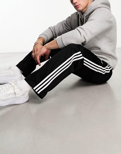 adidas Originals Adicolor firebird track pants in black & white