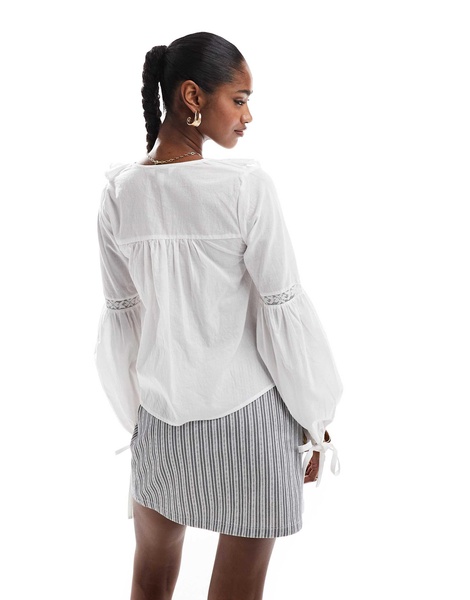 Brave Soul ruffle front long sleeve blouse in white