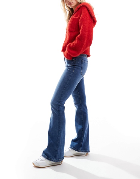Bershka Petite high rise flared jeans in light wash blue