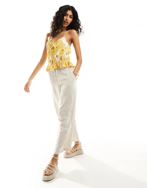ASOS DESIGN shirred peplum cami sun top in yellow floral print