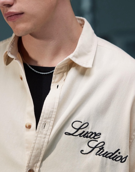 ASOS DESIGN boxy denim overshirt with chest embroidery in ecru