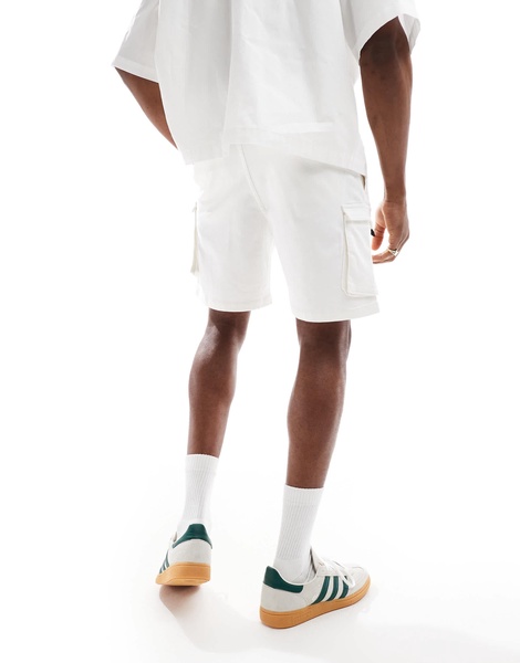 Bershka cargo pocket shorts in white