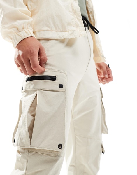 Bershka tech cargo pants in sand