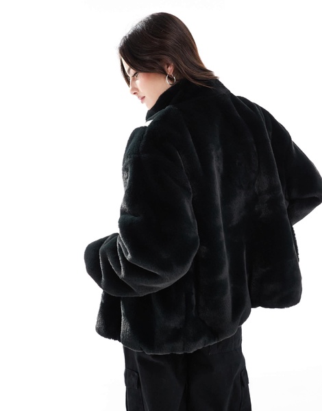 Nike faux fur Swoosh jacket in black