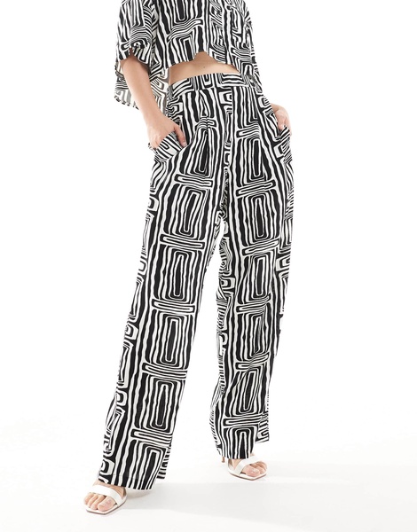 ASOS DESIGN straight leg pull on pants in black and white print - part of a set