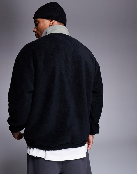 ASOS DESIGN oversized fleece sweatshirt with quarter zip and pocket in black