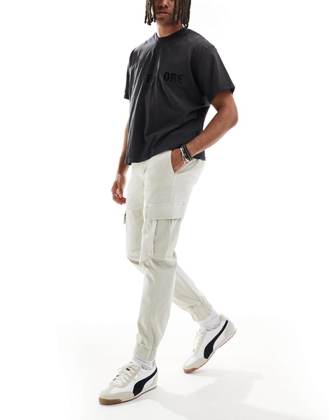 Bershka cuffed cargo pants in beige