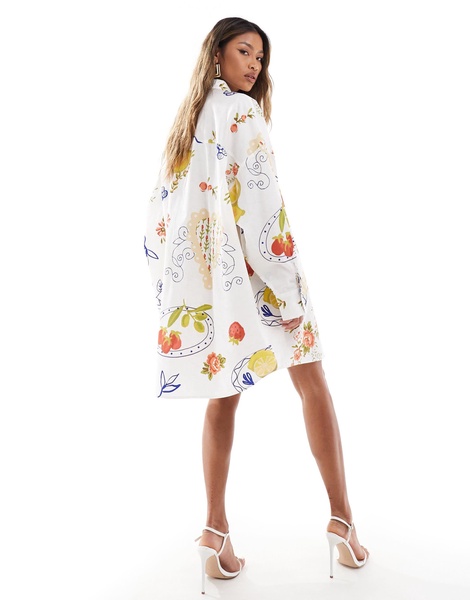 ASOS DESIGN oversized shirt dress with dropped pockets in postcard print
