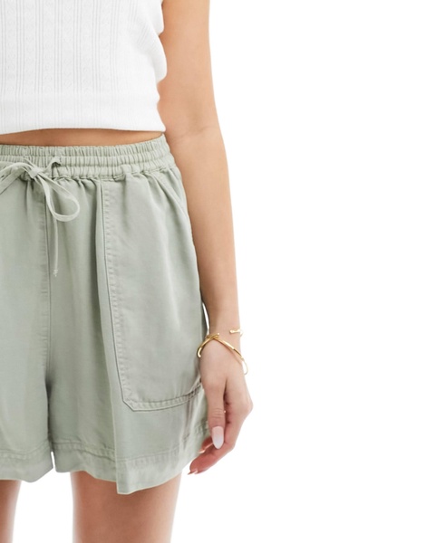 ASOS DESIGN casual shorts with tie waist in washed sage