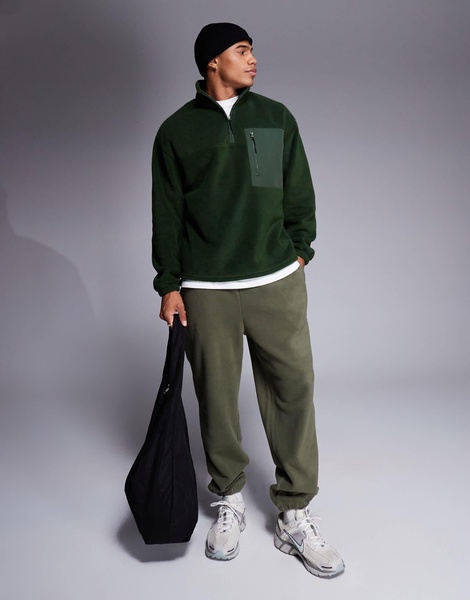 ASOS DESIGN oversized quarter zip fleece sweatshirt in dark green with chest pocket