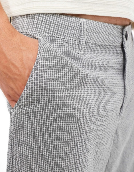 ASOS DESIGN baggy chino pants in black and white textured micro plaid