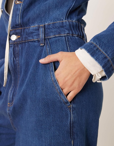 ASOS DESIGN premium collarless denim jumpsuit in midwash blue