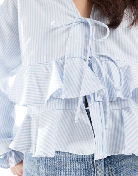 ASOS DESIGN long sleeve tie front ruffle hem top in blue stripe