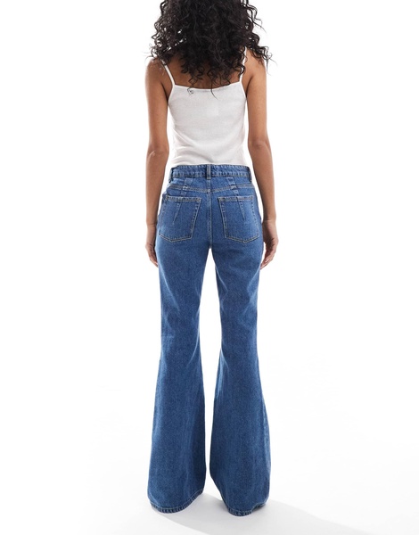 ASOS DESIGN super high waist flared jeans in mid blue