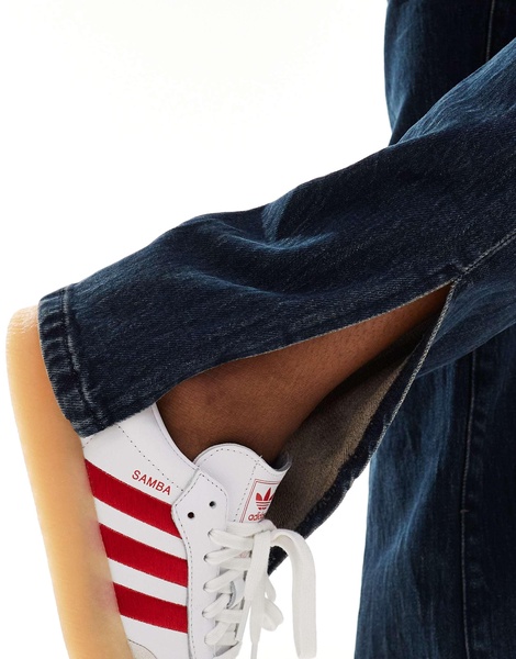 Blank NYC straight leg jeans with slit hem in darkwash blue