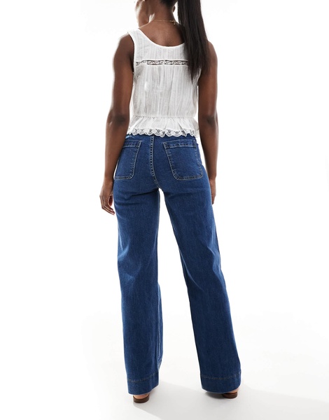 Bershka high waisted pocket detail jeans in mid wash