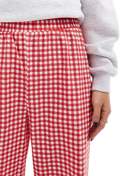 ASOS DESIGN gingham pants with frill hem in red